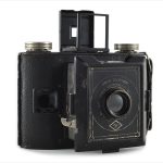 Agfa PD16 Clipper (three quarters, lens extended, viewfinder up)