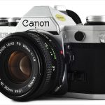 Canon AE-1 (three-quarter view, with Canon FD 50mm f/1.8)