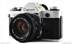 Canon AE-1 (three-quarter view, with Canon FD 50mm f/1.8)